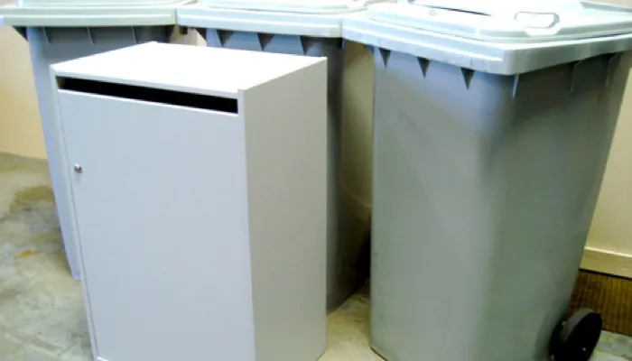 Locked shredding console and wheeled collection bins used between service visits