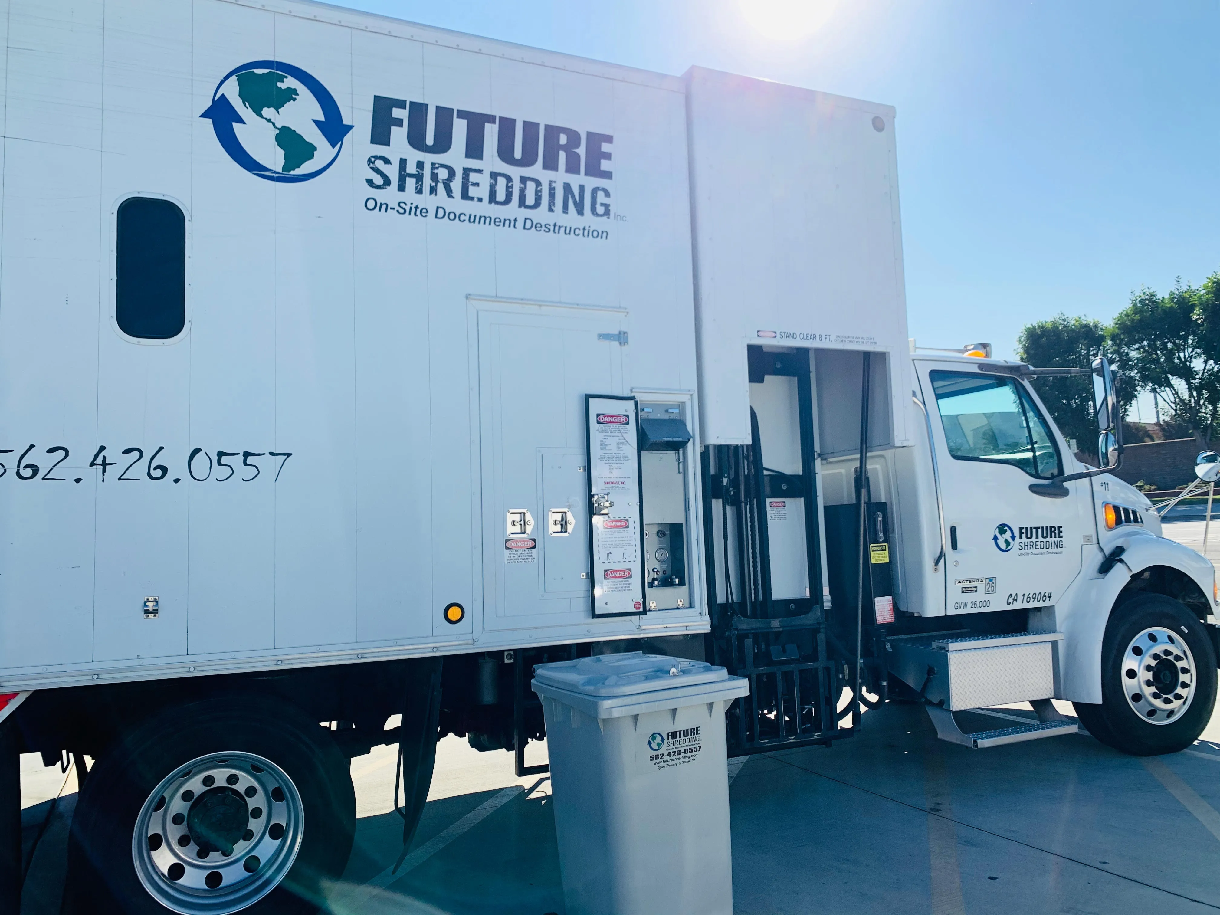 Future Shredding mobile shred truck with a locked collection cart at a Long Beach curb